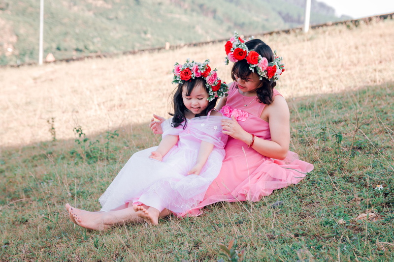 flowering plant, young, family, joy, pink color, outdoors, plant, beautiful, people, leisure, kid, flower, land, daughter, woman, mother, leisure activity