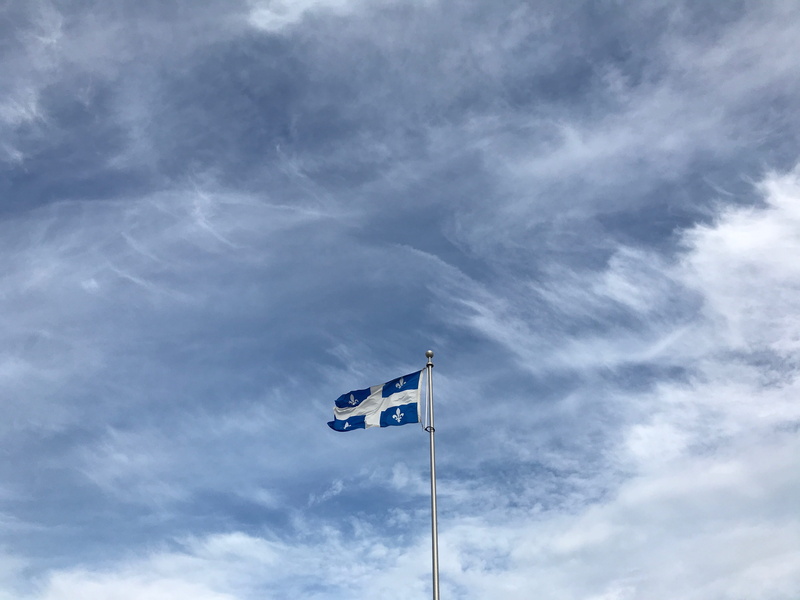flagpole, pole, national icon, white, nature, quebec, outdoors, sky, blue, patriotism, overcast, cloud - sky, environment, wind, country, waving, independence