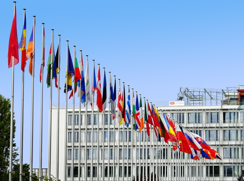 national icon, europe palace, beside, wind, clear sky, blow, strasbourg, day, blue, outdoors, built structure, nature, building, in a row, independence