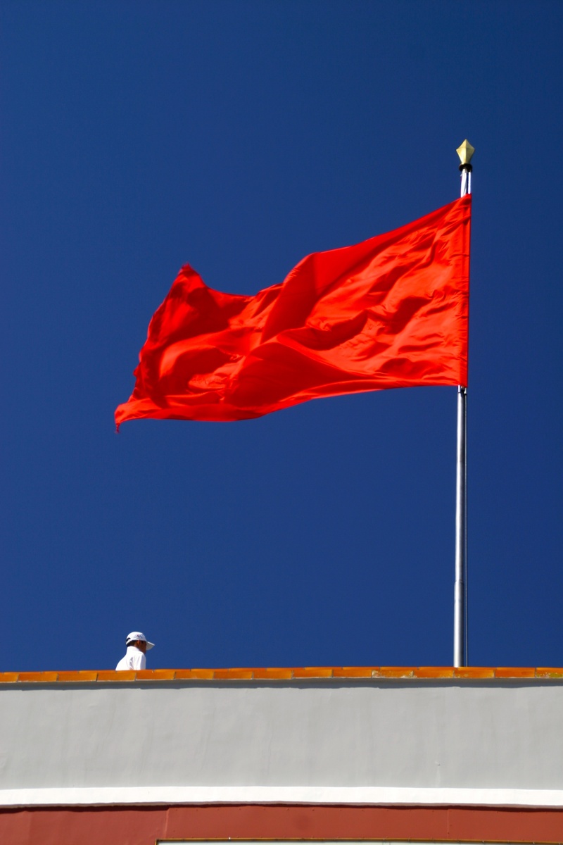 pride, building exterior, sky, day, copy space, low angle view, no people, flutter, 2K, red, patriotism, environment, clear sky, blow, flag, flagpole