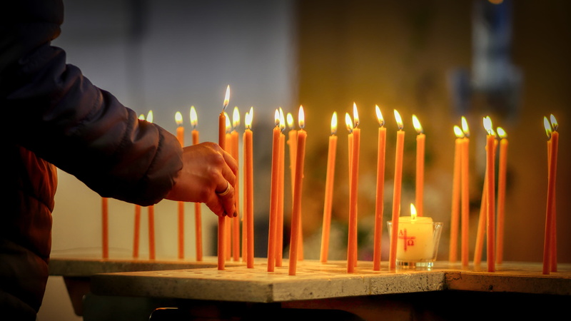 candles, one person, respect, spirituality, flame, fire, heat - temperature, candle, place of worship, nature, burning, kindle, hand, religion, wax, church