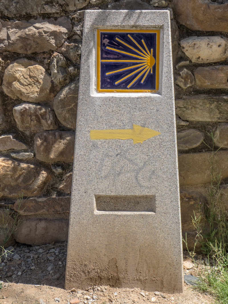 follow, art and craft, stone wall, wall, milestone, no people, yellow, outdoors, near, concrete, built structure, indication, architecture, craft, sign