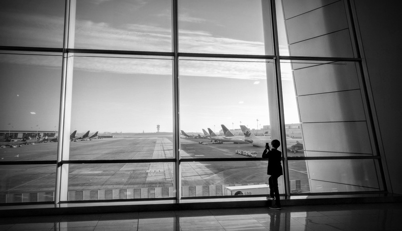one person, architecture, rear view, belgium, flying, air, sky, building, transparent, outdoors, zaventem, passenger, full length, day, women, boy, built structure