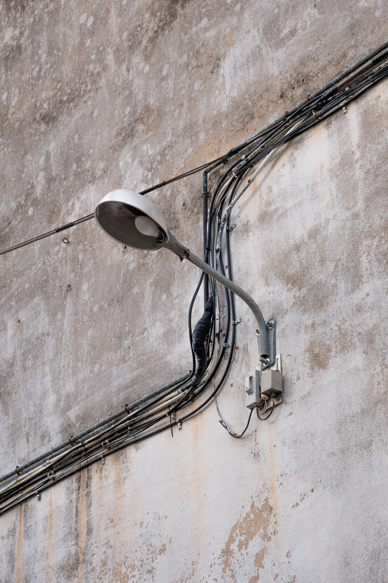 wall, public, building exterior, built structure, texture, connection, low angle view, closeup, cable, cables, light, day, worn, town, building, lighting equipment