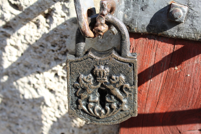 protection, ornate, art and craft, sunlight, entrance, wall - building feature, door knocker, nature, metal, castle, outdoors, door, old, day, close-up