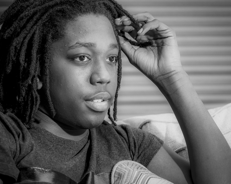 close-up, leisure activity, focus on foreground, young women, 2K, afro hairstyle, BandW, skin, one person, portrait, finger, person, face, headshot, indoors