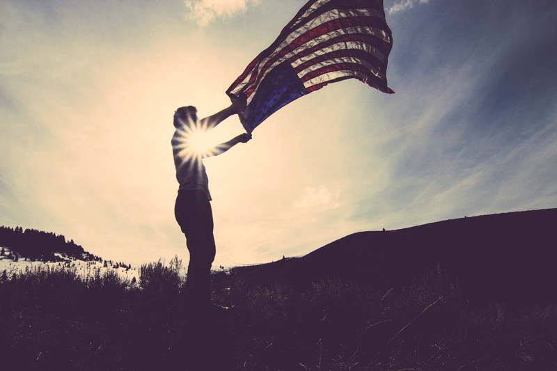 land, united states, american, sun, one person, outdoors, sunlight, flag, cloud - sky, america, low angle view, adults only, sunset, person, one man only