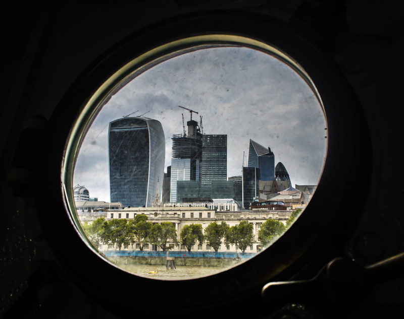 wreath, skyscraper, light, herring, window, plant, city, performer, flare, day, geometric shape, office building exterior, animal, mime, architecture, porthole