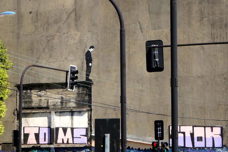 real people, architecture, mime, incidental people, security camera, communication, women, day, street, wall - building feature, built structure, window