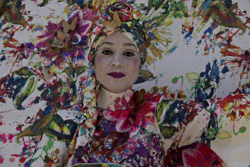 theatre, looking at camera, pantomina, representation, portrait, day, human representation, mime, floral pattern, one person, indoors, close-up, multi colored