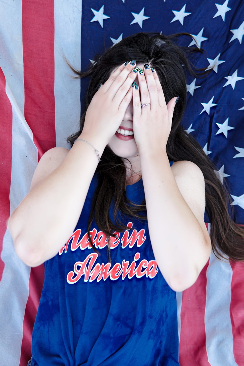 hands, fourth of july, usa, stars and stripes, white color, young women, holiday, united states, patriotism, real people, smile, lifestyles, women, blue