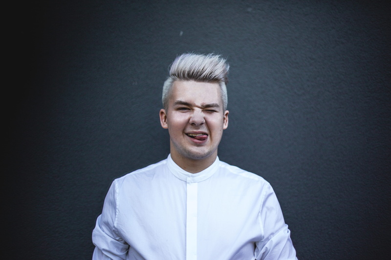 adult, smiling, facial expression, indoors, 5K, headshot, man, person, blonde, wearing, standing, top, confidence, looking at camera, Gay Pride, gray background