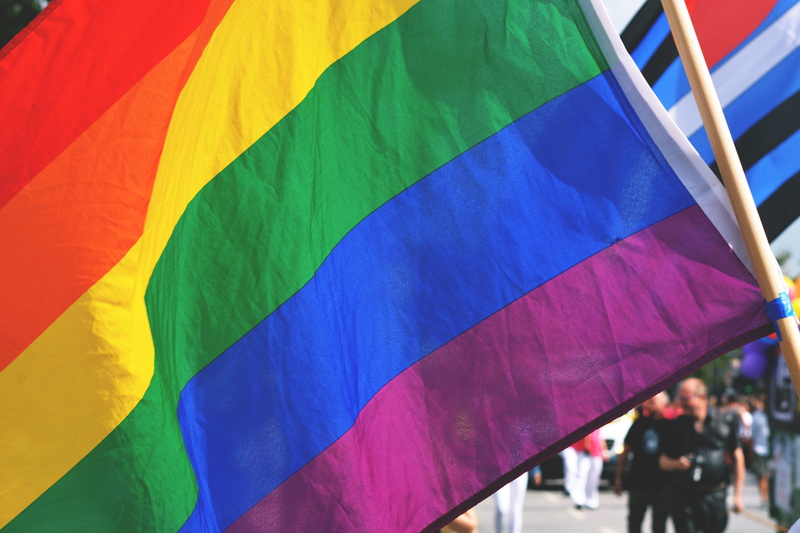 umbrella, outdoors, lGBT, wind, multi colored, incidental people, color, flag, rainbow, green, people, striped, pride, crowd, various, march, yellow, real people