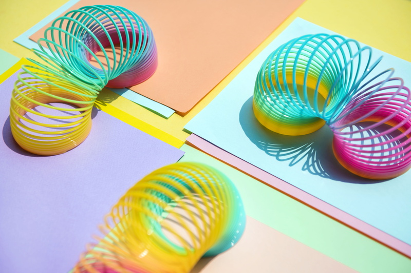 no people, slinky, background, ball, medium group of objects, spiral, pattern, indoors, group of objects, studio shot, variation, table, choice