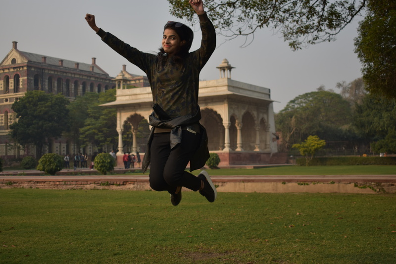 happy, young adult, full length, human arm, flying, plant, 5K, girl, clothing, arms raised, built structure, outdoors, building exterior, architecture