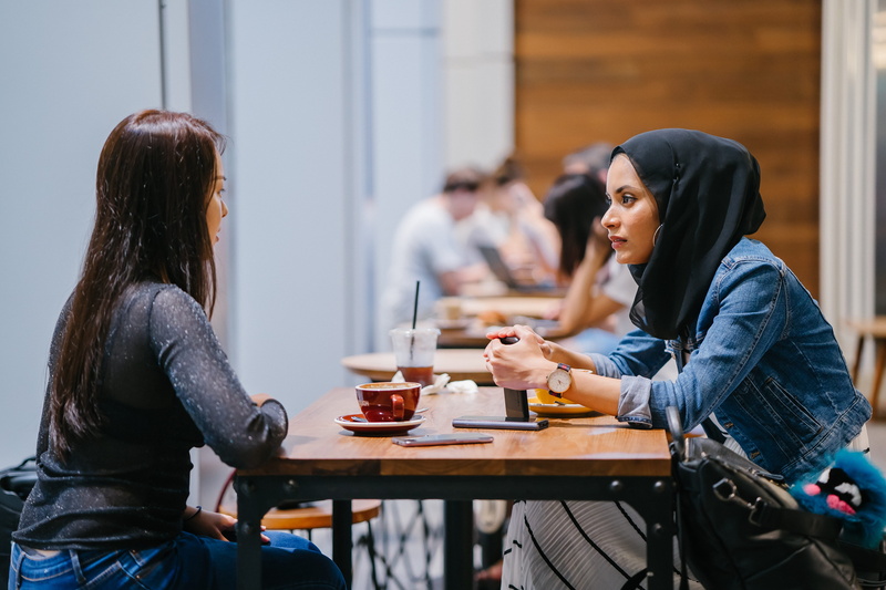 coffee shop, real people, drinks, friends, tables, wear, drink, women, sitting, coffee - drink, lifestyles, muslim, beautiful woman, young adult, young women