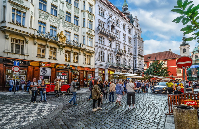sky, tourist, street, city, sidewalk cafe, urban Scene, group of people, people, tourism, built structure, walking, cityscape, outdoors, travel, cloud - sky