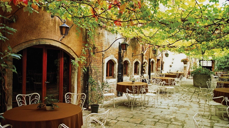 city, tree, growth, built structure, arch, 720P, Village, day, table, no people, Italy, plant, empty, outdoors, setting, building exterior, building, architecture