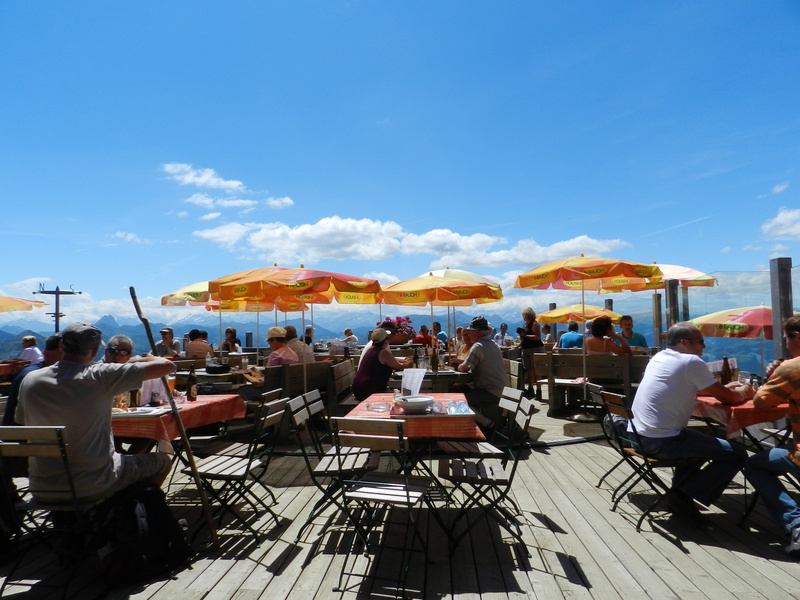 chair, women, austria, food and drink, crowd, table, business, men, umbrellas, real people, sky, people, outdoors, sidewalk cafe, adult, sitting, leisure activity
