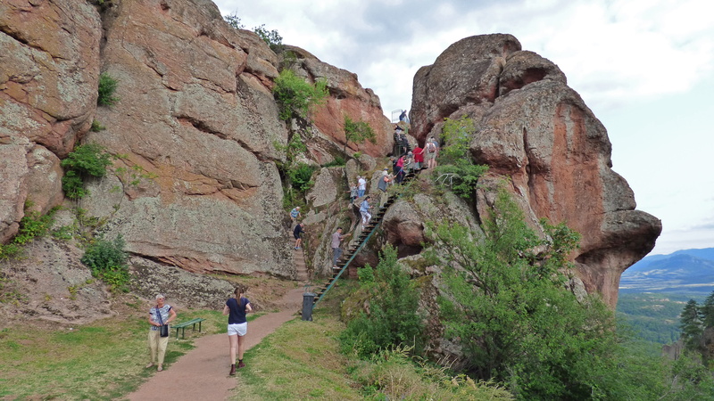 lifestyles, solid, women, non-urban scene, walking, day, mountain, belogradchik, scenics - nature, sky, cloud - sky, bulgaria, rock, 4K, mountain range