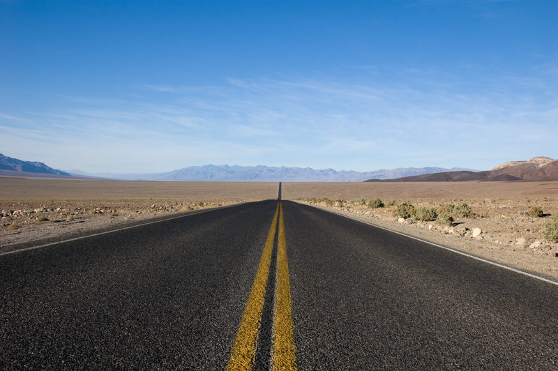 direction, sky, desert, outdoors, vanishing point, pavement, environment, 2K, land, symbol, dividing line, dirt, arid climate, road, straight, scenics - nature