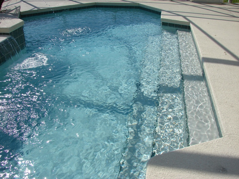high angle view, architecture, sunlight, poolside, railing, shadow, sunny, day, luxury, blue, pool water, rippled, sea, spa, 2K, pool steps, no people