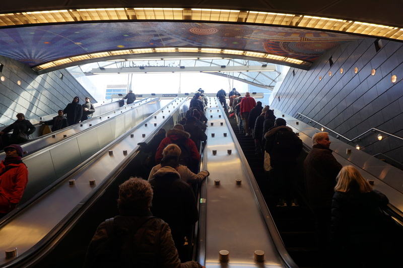 city, stadium, indoors, audience, person, mode of transportation, night life, handrail, leisure activity, public transportation, large group of people