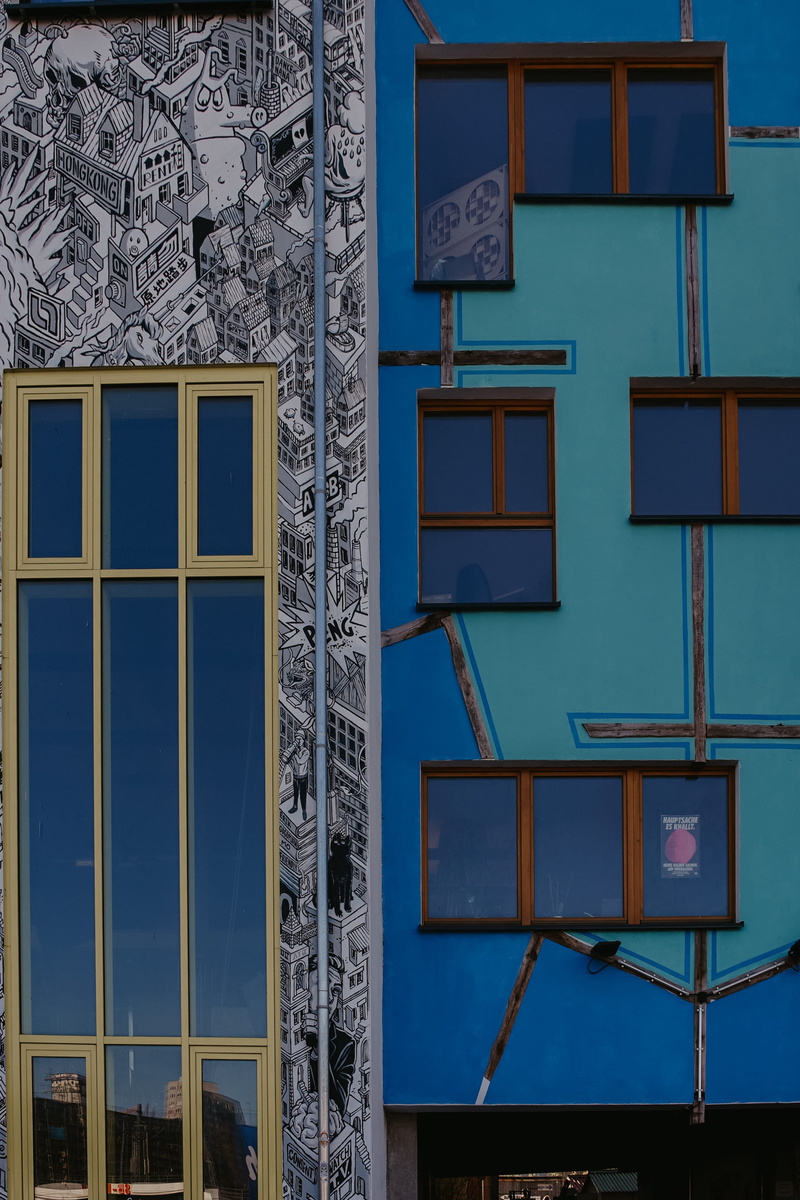 low angle view, house, architecture, blue, day, residential district, nature, wall - building feature, bmx, building, tower, handrail, bicycle, full frame