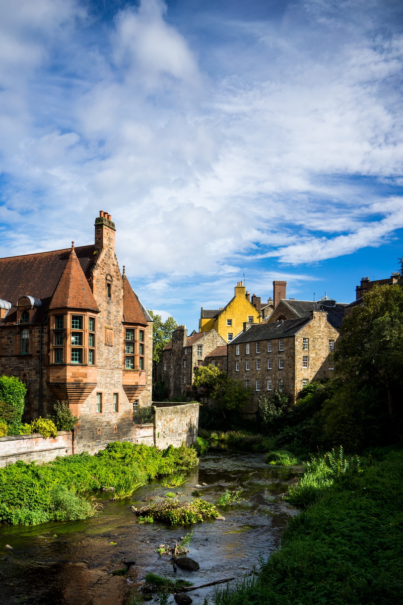 river, outdoors, plant, grass, building, moat, tree, travel destinations, town, house, near, built structure, urban, small, cloud - sky, roof, fort, spire