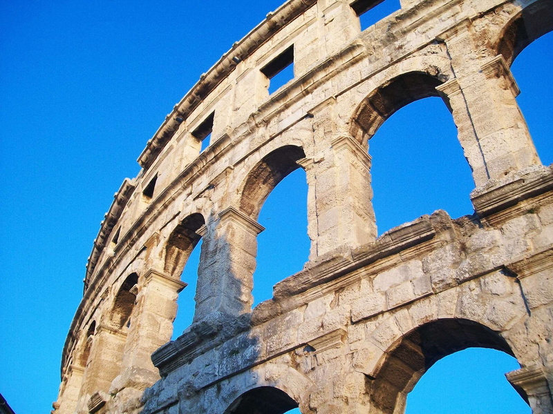 blue, arena, the past, built structure, architecture, clear sky, croatia, architectural column, pula, tourism, low angle view, history, ancient history