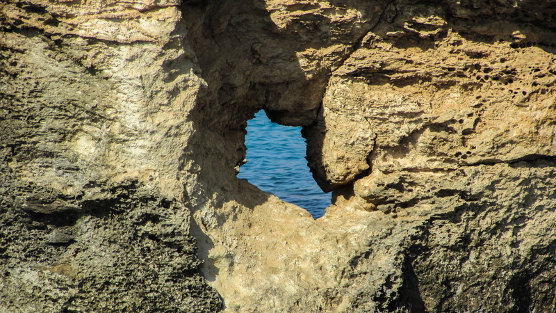 rock formation, window, nissia, tourism, arch, rock formations, day, rocky coast, tranquil scene, eroded, beauty in nature, rock - object, non-urban scene
