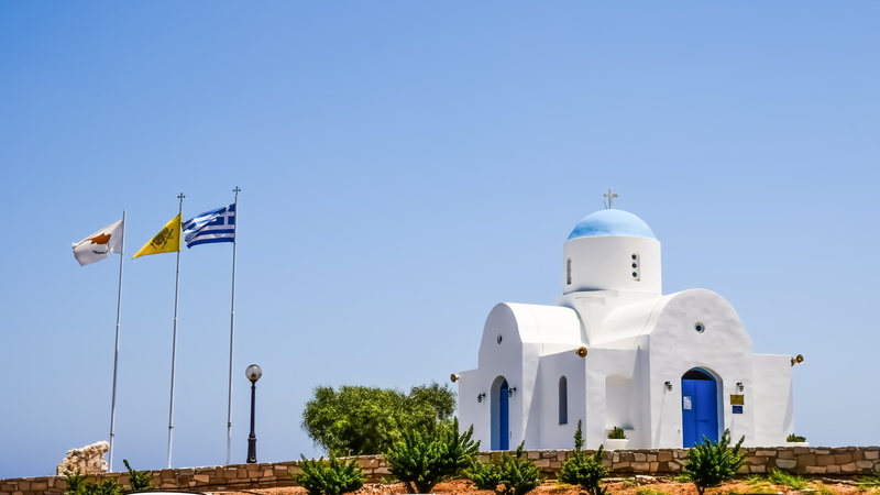 sunny, 5K, flag, building exterior, church, ayios nikolaos, outdoors, building, plant, religion, spirituality, clear sky, travel destinations, patriotism
