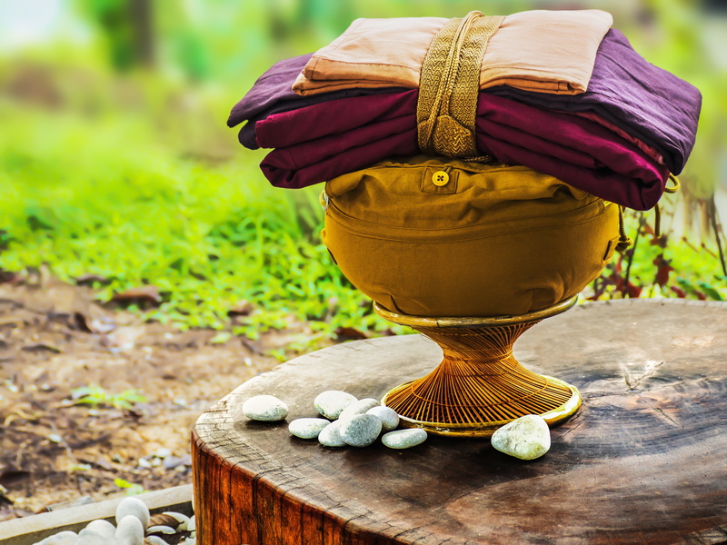 temple, bowl with robes, focus on foreground, monastery, robe, wood - material, buddhist, green color, food, yellow, day, outdoors, become monk, ordain