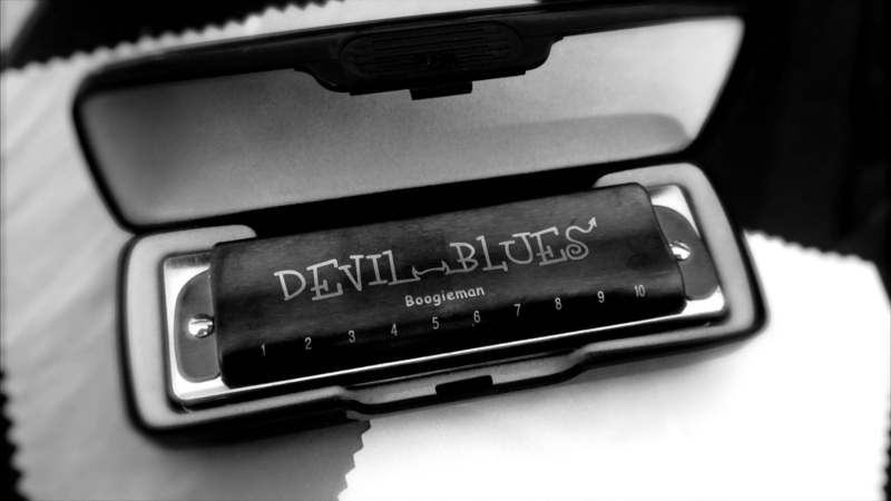 blues, connection, focus on foreground, ten-hole harmonica, music, screen, indoors, studio shot, equipment, harmonica, single object, text, western script