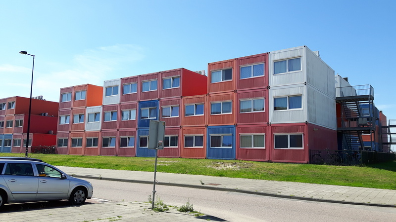 motor vehicle, sea container, mode of transportation, residential district, student housing, housing development, house, home ownership, day, modern, building