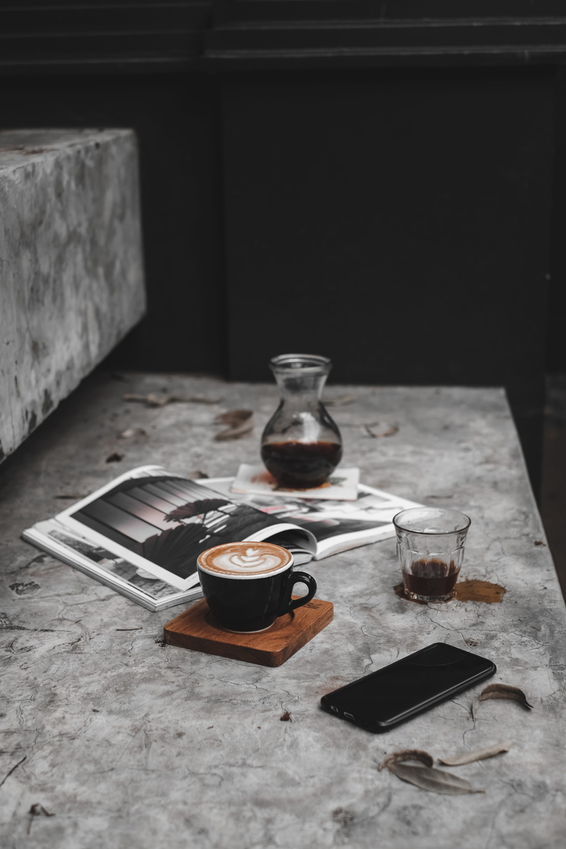 saucer, household equipment, wood - material, high angle view, mug, home decor, black, beverage, indoors, hot drink, beside, art, table, dining table, kitchen utensil