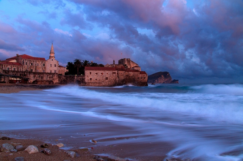 nature, built structure, land, travel destinations, history, wave, outdoors, beach, long exposure, building, building exterior, sky, budva, montenegro