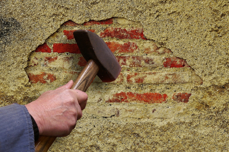 personal perspective, bang on the plaster, brown, people, tool, symbolic, holding, nail, human finger, wall - building feature, close-up, metal, adult