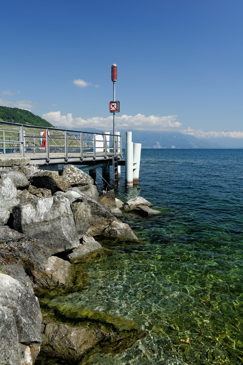 no people, outdoors, tranquil scene, rock, sign, horizon over water, switzerland, 2K, investors, solid, horizon, lake geneva, sea, rock - object, guidance