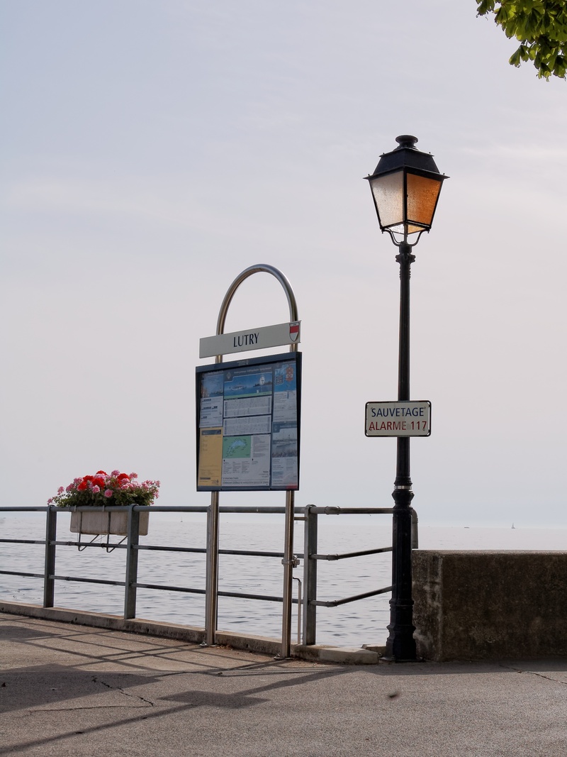 text, sign, lutry, lantern, sea, lighting equipment, built structure, day, street, switzerland, beach, no people, 2K, railing, communication, architecture