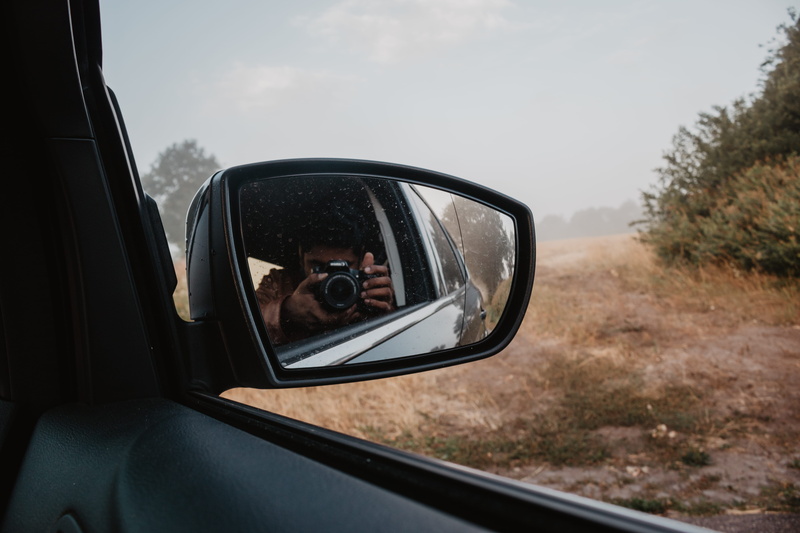 taking, person, human, plant, outdoors, vehicle interior, day, reflection, mode of transportation, digital camera, one person, real people, electronics