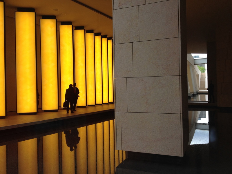 real people, corporate, urban, architectural column, business, office, style, talking, people, illuminated, two, walking, hallway, corridor, modernism