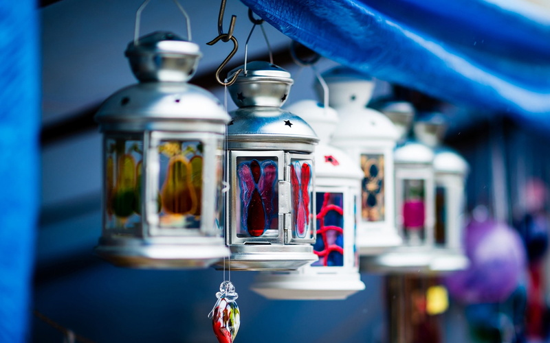 photography, lantern, transparent, business, stained glass, container, focus on foreground, shopping, selective focus, choice, retail display, no people