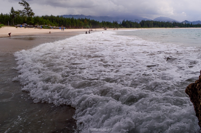 cloud - sky, outdoors, idyllic, tranquil scene, incidental people, beach, landscape, tranquility, sand, motion, surfing, nature, greenery, laut lampuuk