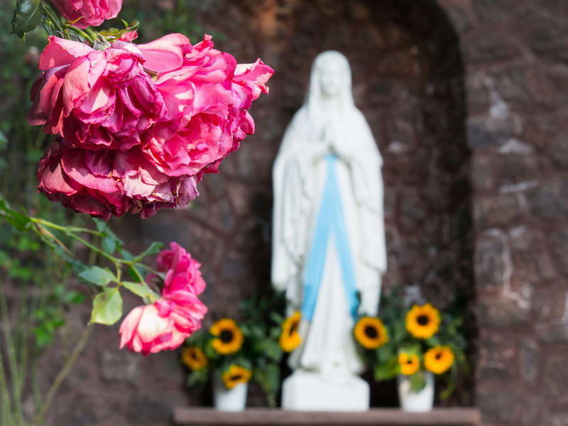 fragility, art and craft, outdoors, nature, belief, faith, virgin mary, plant, human representation, flower head, representation, focus on foreground, madonna