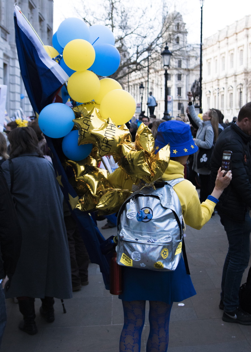 group of people, crowd, obscured face, city, woman, celebration, shoe, outdoors, architecture, clothing, brexit, built structure, uniform, beautiful, mascot