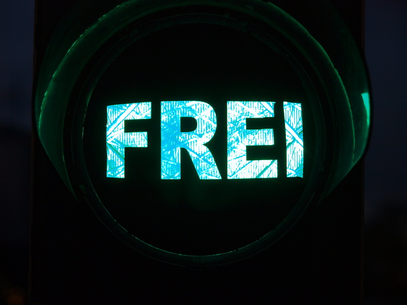 indoors, brexit, light, stoplight, mode of transportation, close-up, communication, representation, guidance, glowing, sign, black background, technology