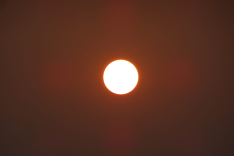 no people, orange color, circle, outdoors, sun, astronomy, sunset, copy space, shape, tranquility, idyllic, beauty in nature, scenics - nature, low angle view
