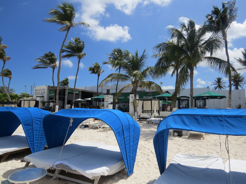 blue, land, seat, relaxation, plant, summer, chair, aruba, growth, tourist Resort, built structure, swimming pool, palm Tree, sunlight, travel, outdoors