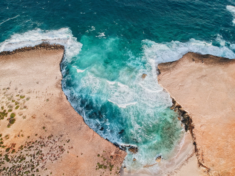 land, turquoise colored, aquatic sport, beach, landscape, non-urban scene, coconut, nature, basin, sky, beauty in nature, aruba, sand, no people, wave